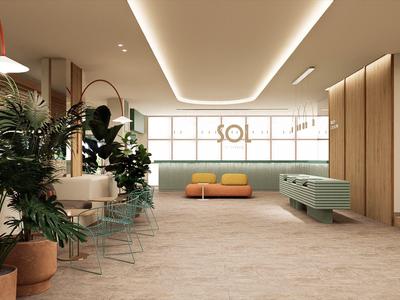 Moderner Hotel-Loungebereich mit Pflanzen, Holzverkleidungen und gemütlichen Sitzgelegenheiten.