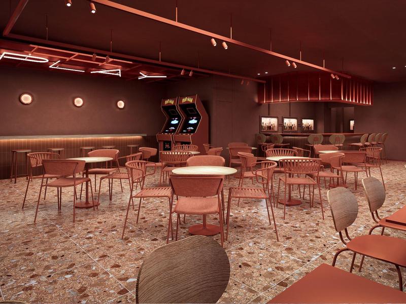 Moderner Hotel-Loungebereich mit Tischen, Stühlen und Spielautomaten in gedämpftem Licht.