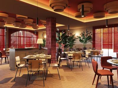 Modernly furnished hotel restaurant area with tables, chairs, and warm lighting.
