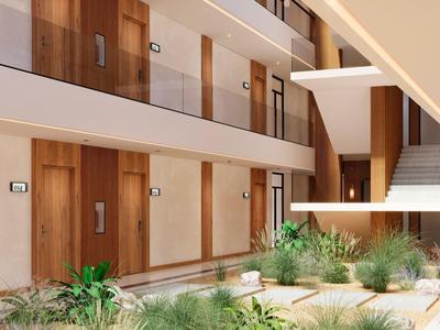 Moderner Innenhof mit Holzverkleidung, Pflanzenbeeten und mehrstöckigem Flur mit Treppe.