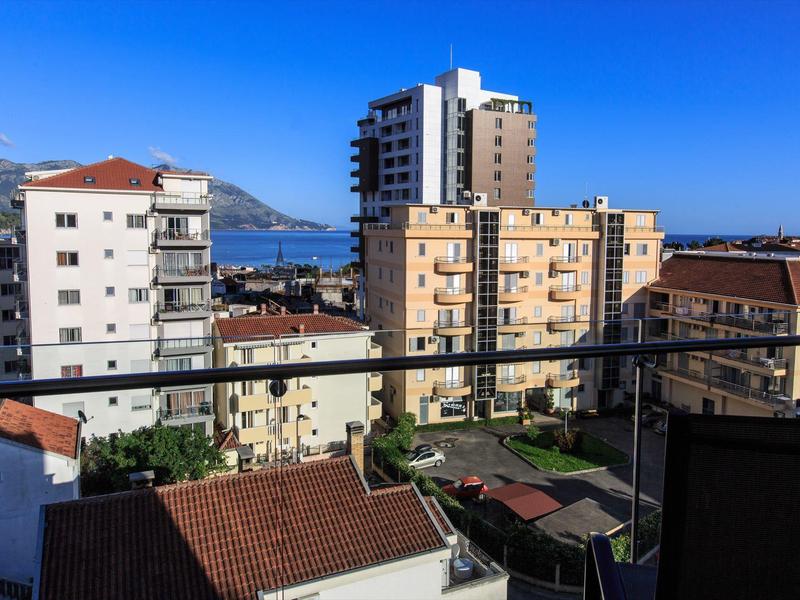 Urban view with several multi-story buildings under a clear blue sky