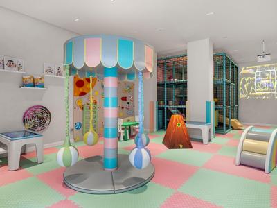 Aire de jeux intérieure colorée avec structures d'escalade et tapis doux dans un hôtel.