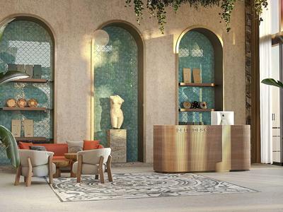 Moderní recepční prostor s pultem, posezením a rostlinami před zelenou zdí s oblouky.