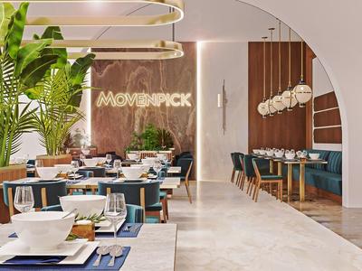 Moderní restaurace s rostlinami a elegantním zařízením v teplých tónech.