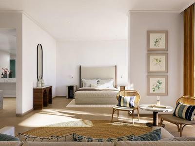 Helles Hotelzimmer mit Doppelbett, Sitzbereich und großem Fenster mit Blick auf Pflanzen.