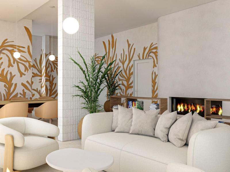 Modern eingerichtetes Wohnzimmer mit runden Sofas, Kamin und goldenen Wanddekorationen.