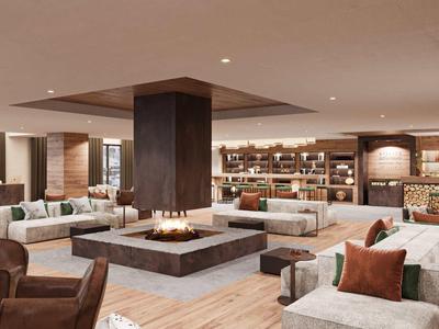 Salon d'hôtel moderne avec cheminée, fauteuils confortables et grandes fenêtres avec vue sur la ville.