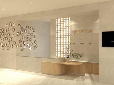 Lichte receptieruimte met moderne houten balie, wanddecoratie en digitaal scherm.