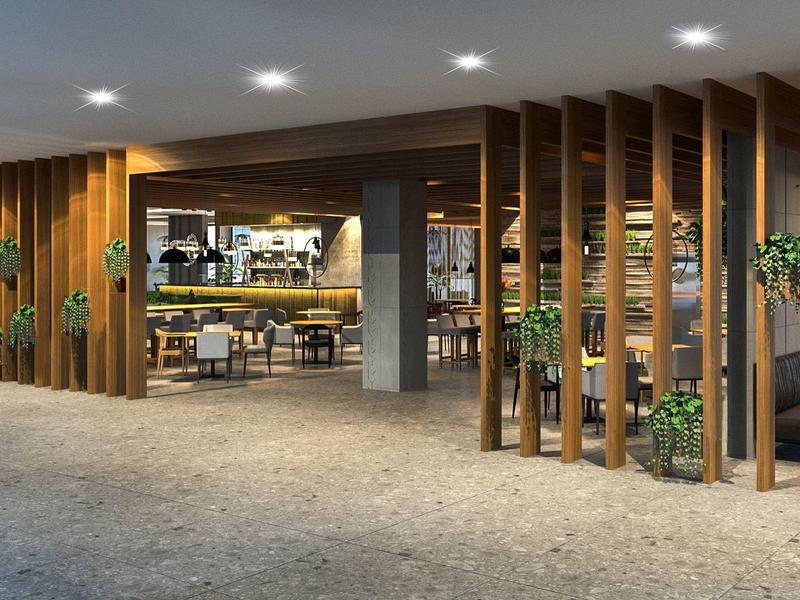 Moderní hotelová lobby s dřevěnými přepážkami a pohodlným posezením.