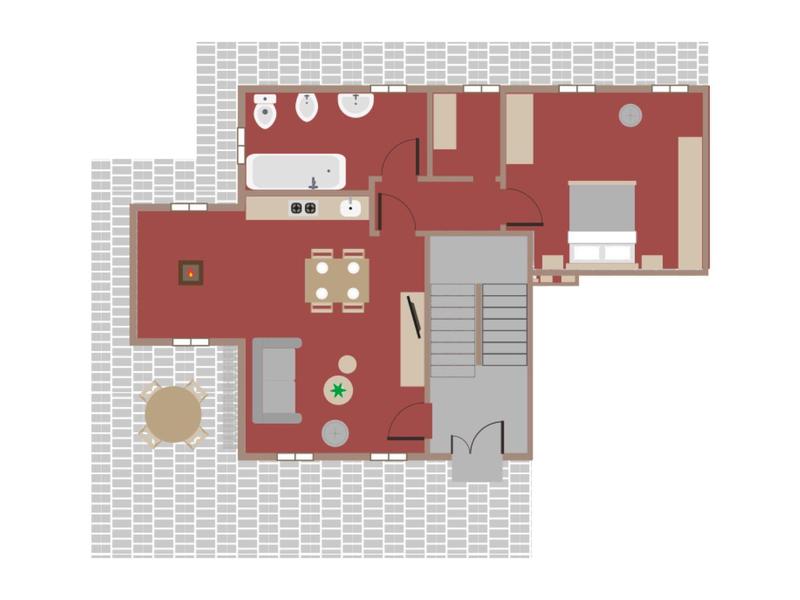 Grundriss mit Schlafzimmer, Küche, Essbereich, Wohnzimmer und zwei Badezimmern auf rotem Boden.