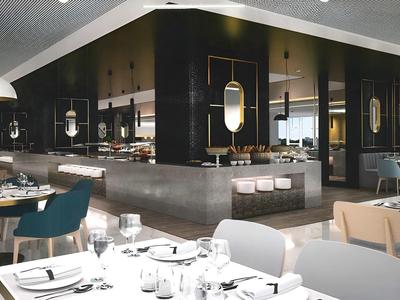 Modern restaurant with elegantly set tables and stylish interior design.