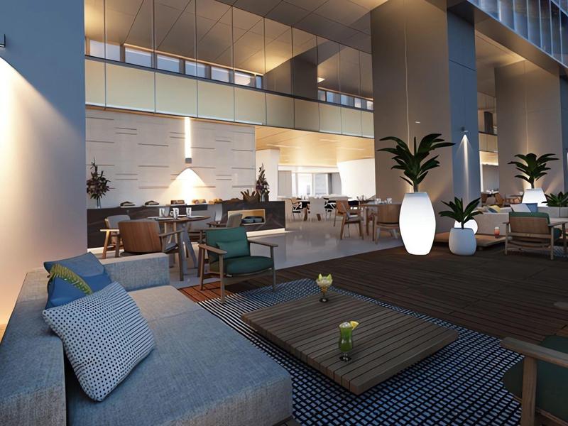 Modern outdoor lounge with cozy seating and stylish lighting at a hotel.