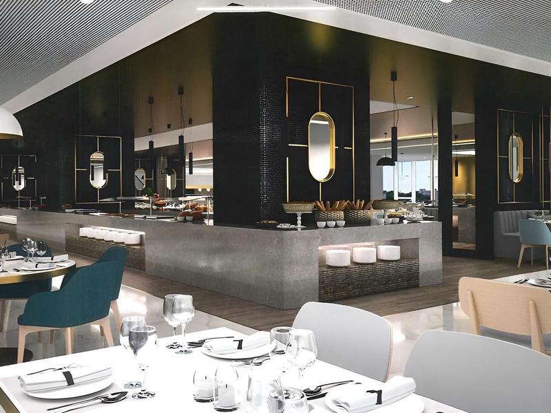 Modern restaurant with elegantly set tables and stylish interior design.