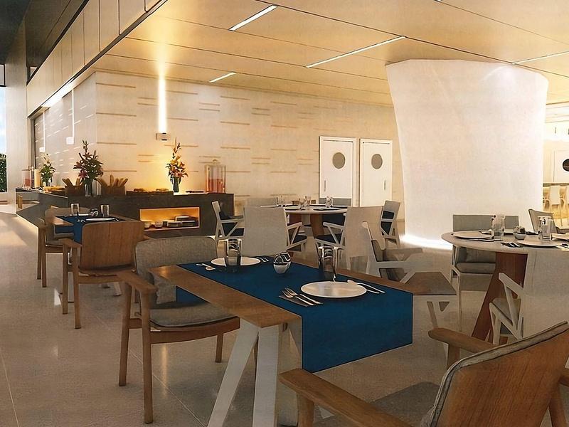 Bright, modern restaurant with wood paneling and stylish wooden furniture.