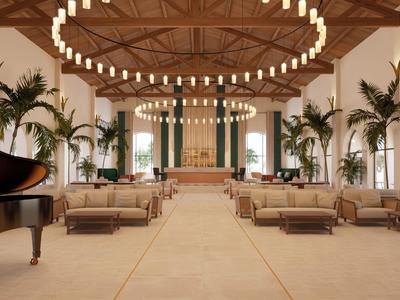 Elegante sala lounge dell'hotel con soffitti alti, grandi lampadari e palme.