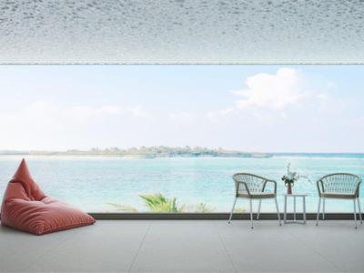 Modern balcony with cozy seating and a view of the sea on a sunny day.