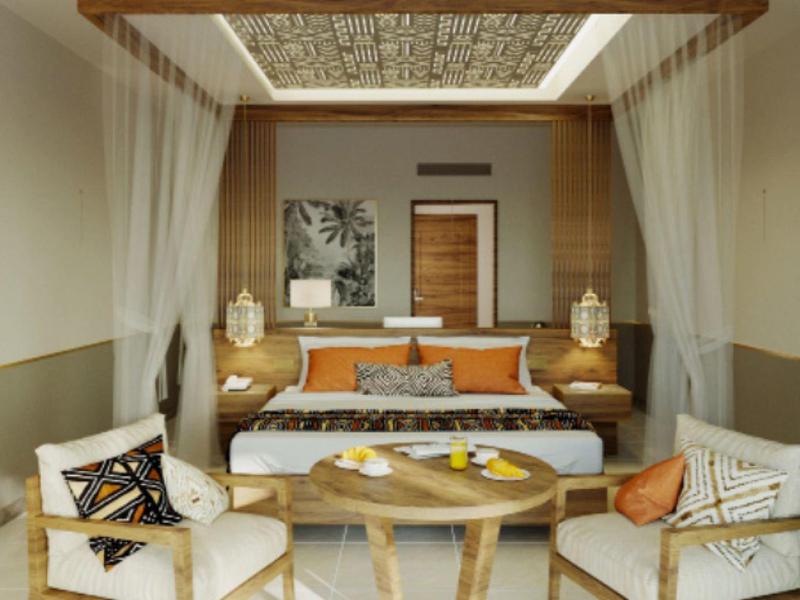 Elegancki pokój hotelowy z łóżkiem podwójnym, miejscem do siedzenia i nowoczesną drewnianą dekoracją.