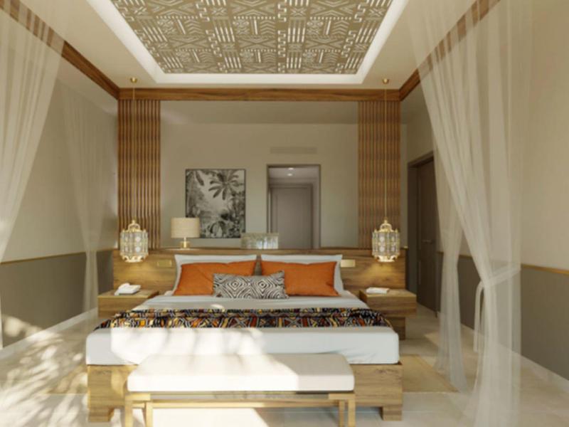 Elegancki pokój hotelowy z dużym łóżkiem, zasłonami i nowoczesnym oświetleniem sufitowym.