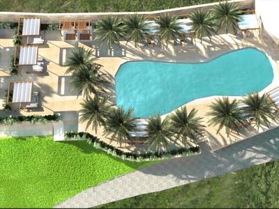 Vista aerea di una piscina d'hotel circondata da palme e lettini.