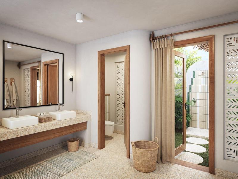 Helles Badezimmerschrank mit Doppelwaschbecken, offenem Türbereich und Glastür zum Garten.