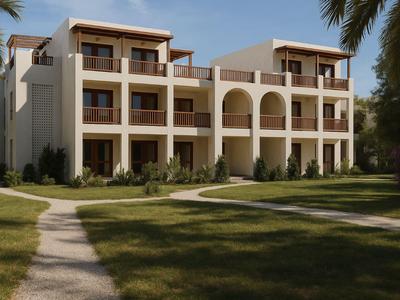 Complesso edilizio moderno su più piani con balconi, circondato da giardino curato e palme.