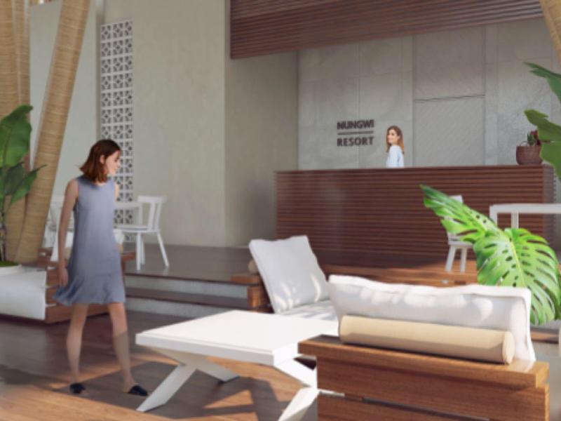 Moderne Hotellobby mit Empfang, Sitzgelegenheiten und großen Pflanzen für ein einladendes Ambiente.