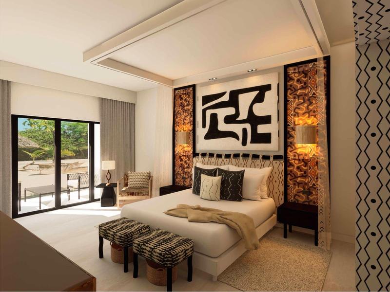 Modernes Hotelzimmer mit großem Bett, abstrakter Kunst und Terrasse mit Poolblick.