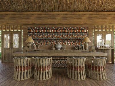 Bar aperta con bancone in legno e sgabelli intrecciati in resort tropicale con tetto di paglia