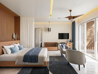 Hell eingerichtetes Hotelzimmer mit Holzdetails, großem Bett, Sitzbereich und Balkon mit Meerblick.