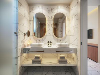 Modernes Badezimmer mit doppeltem Waschbecken, ovalen Spiegeln und Marmorfliesen